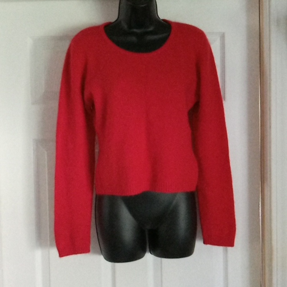 Andre Segere, large red sweater